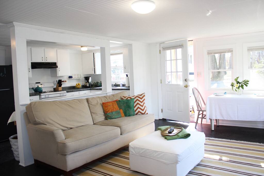 Downstairs space features open floorplan with comfortable living room open to a full kitchen
