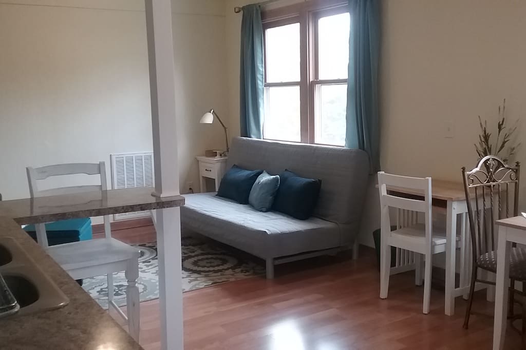 Living room with ikea sofa/couch and chair, Smart TV and small desk