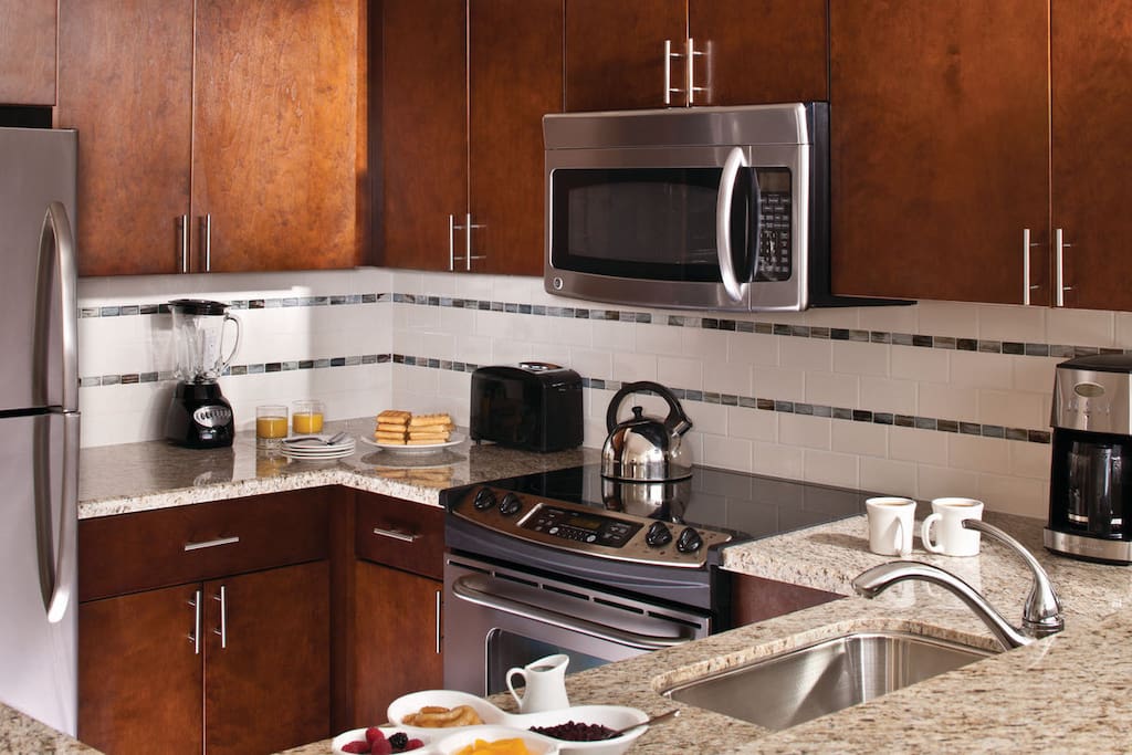 Open Kitchen with stainless steel appliances and granite counter tops.