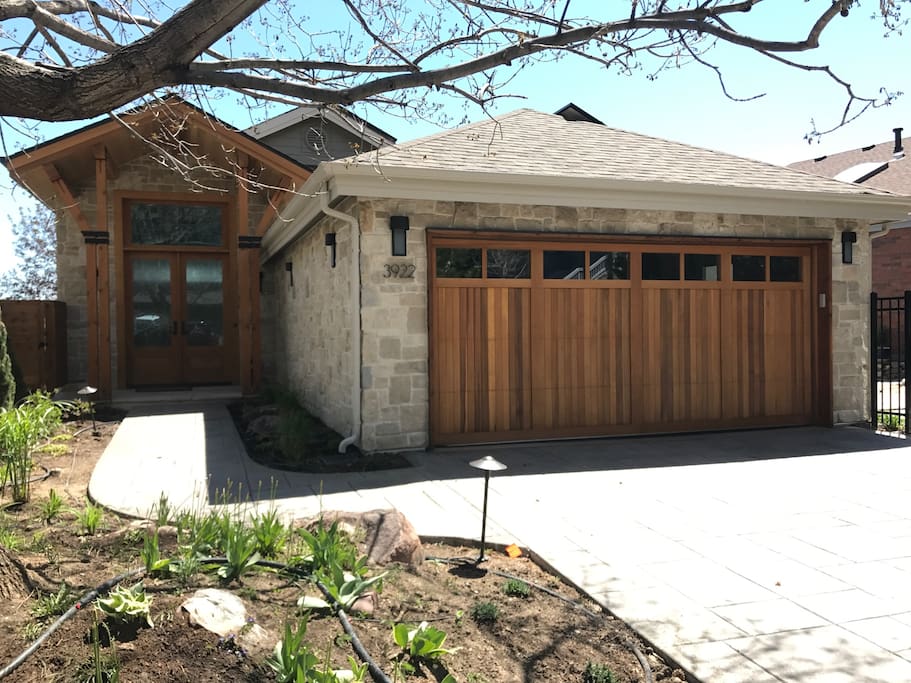 Brand new remodel with limestone and cedar wood garage door. 8ft double door entrance.