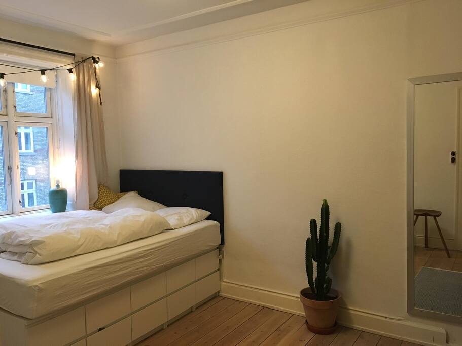 Bedroom with high bed