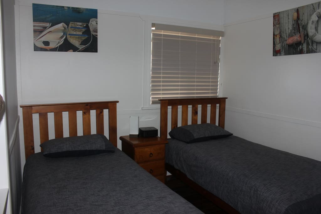 2 single beds in the second bedroom