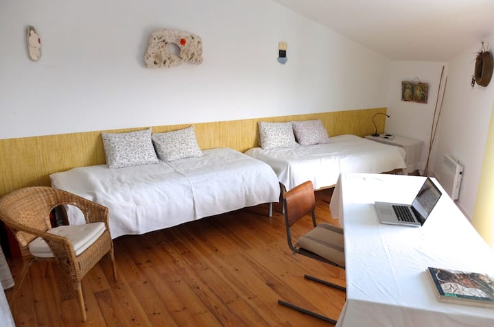 Bedroom 3, furnished here with a work table, is the largest of the three bedrooms...