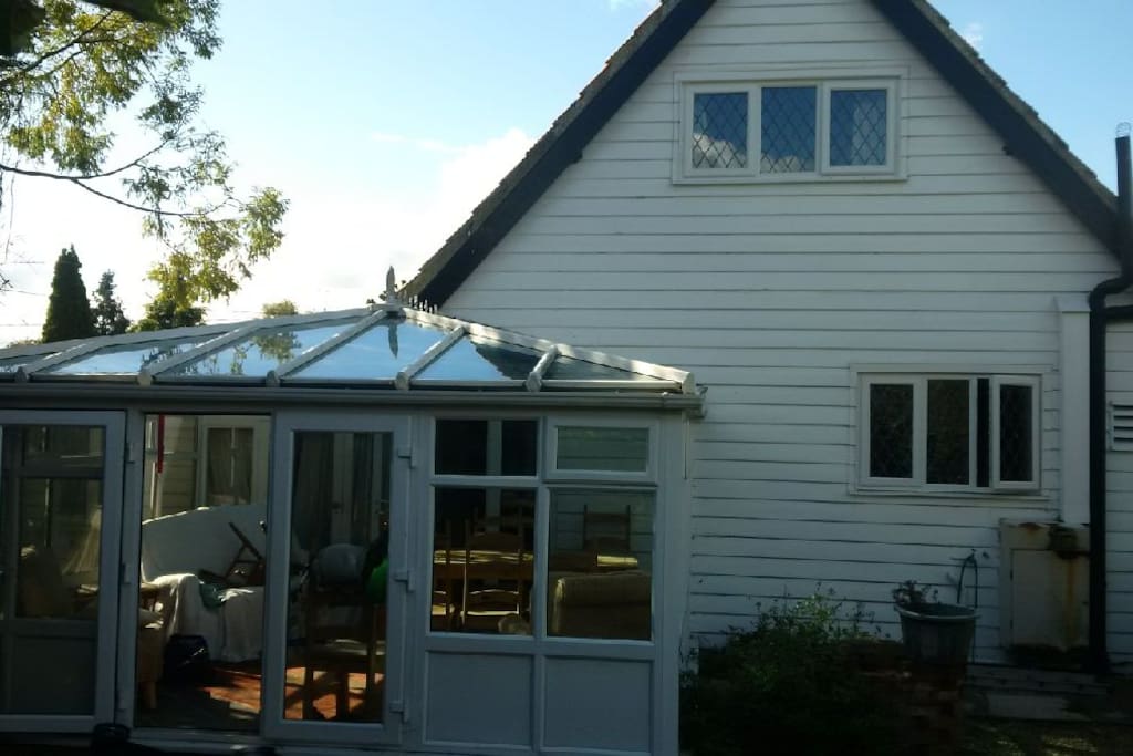 Rear of cottage and conservatory