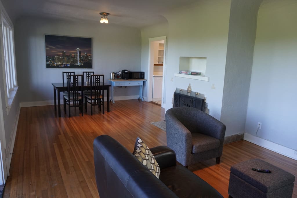 Common area, with dining table, coffee/tea bar and fireplace.