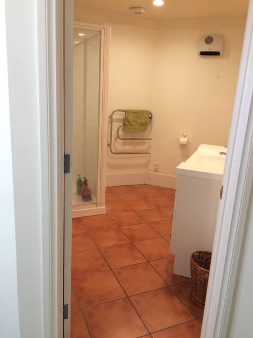 Bathroom with shower directly across hall.