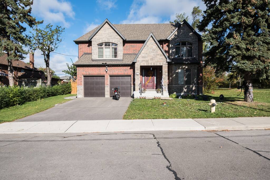 This is the front of the house. You will come into the basement suite through the east (right) gate.