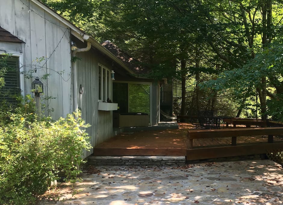 The entire house and deck stretch along the beautiful, wide creek.