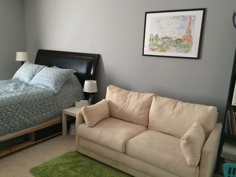 There is a couch for reading or relaxing.