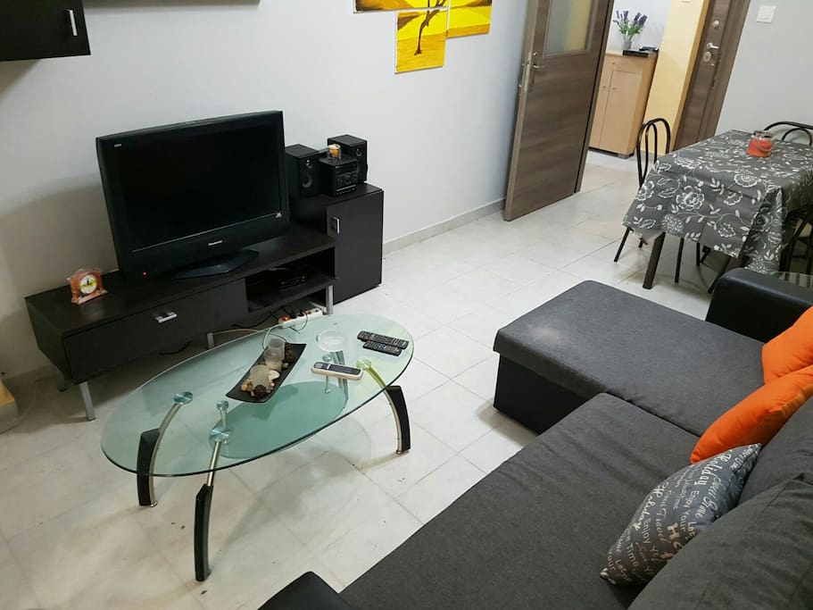 living room - corner sofa which easily becomes a double bed. Air conditioner. Dining room with 4 chairs. Shelf. Composite TV and Stereo. coffee table. full 4g Wi-Fi.