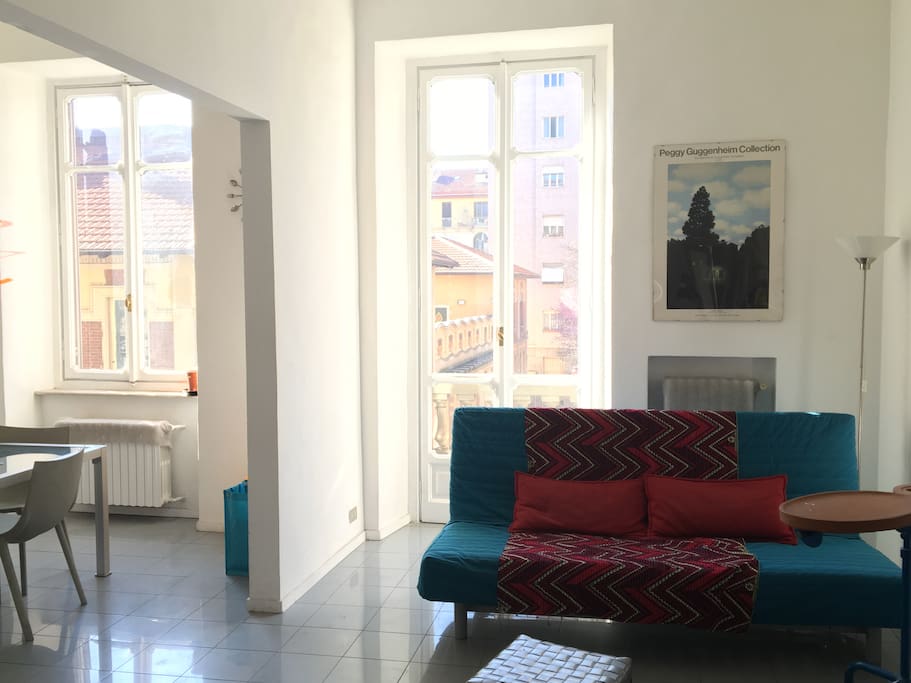 Pull-out couch and large windows.