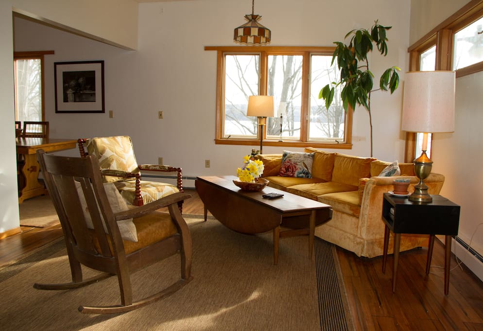 The living room, complete will a large wall mounted TV.