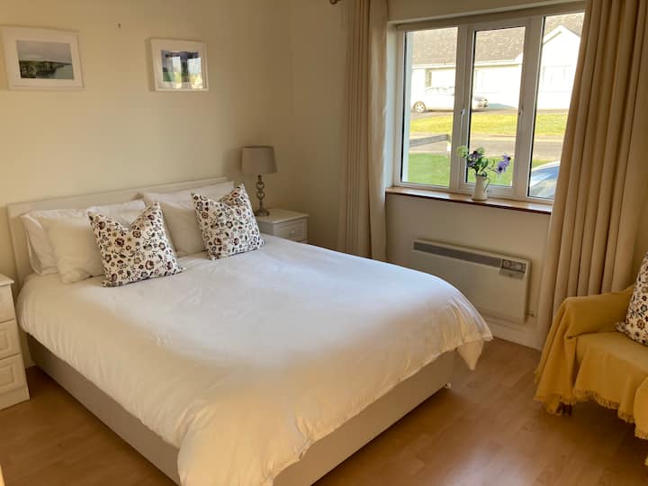 Master bedroom with king size bed and en-suite