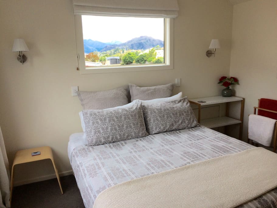 Second queen bedroom, with views of the lake and mountains.