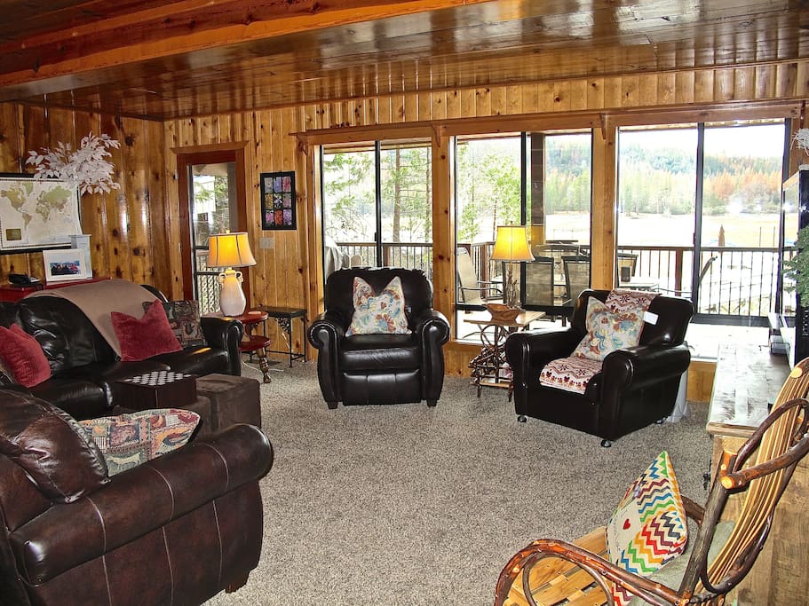 Living Room with doorway to the Covered Deck and walk to your Dock.