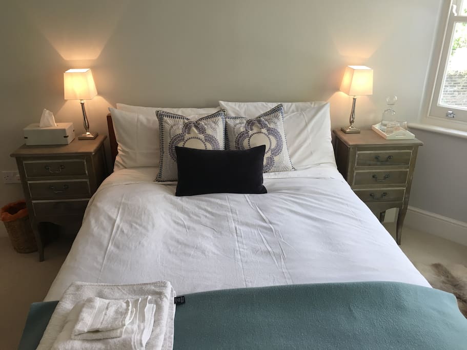 Immaculate room with crisp white sheets, stylish cushions, new carpets and freshly painted walls. The side lamps are touch sensitive too! There are also tissues and a water jug and glasses by the bed. We do our best to make sure you have everything you need.