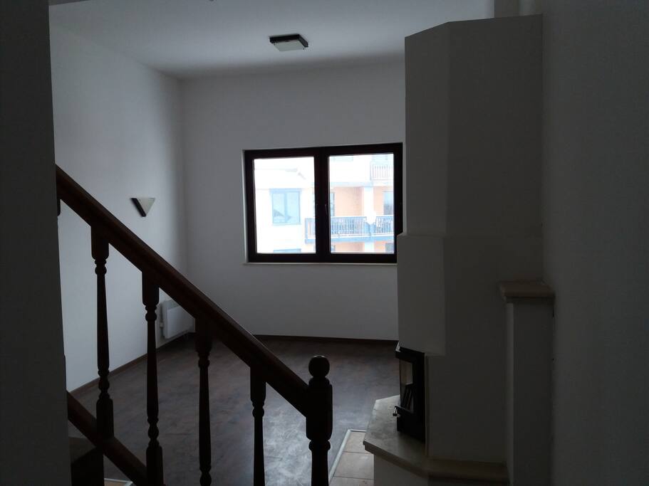 sitting room with balcony and fireplace