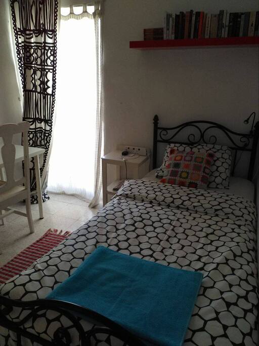 The single room has a small balcony looking to the quiet back gardens of surrounding houses.