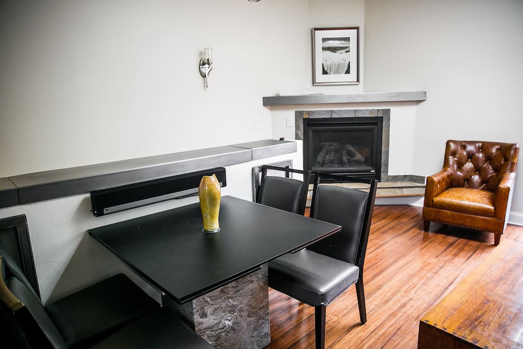Living Area and Fireplace (65 inch Sony TV with Theater sound sunk into the wall behind the Table)