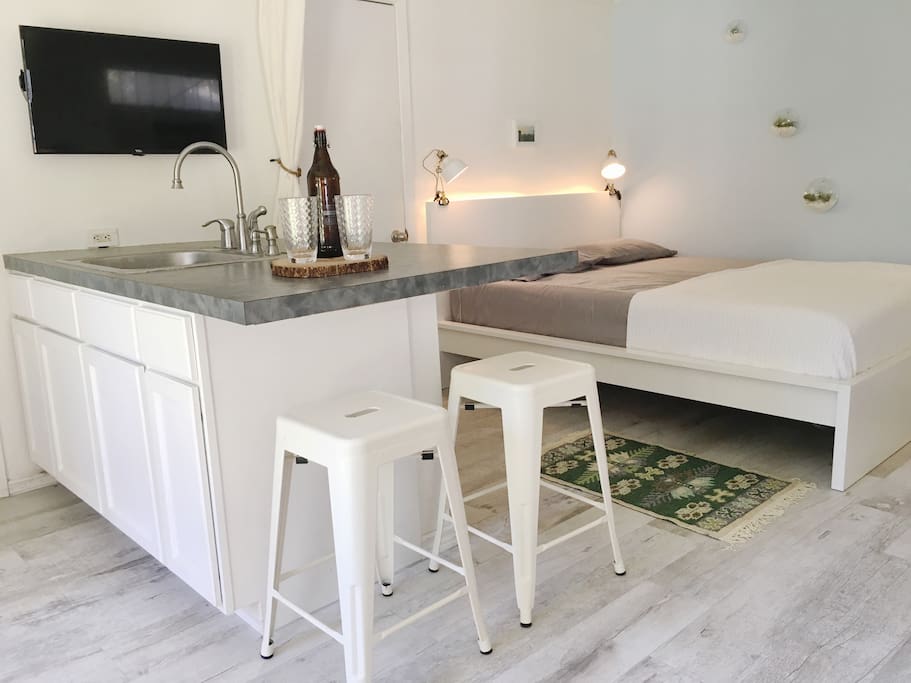 Bar seating at island, streaming TV and movies via Netflix, Amazon and PS Vue