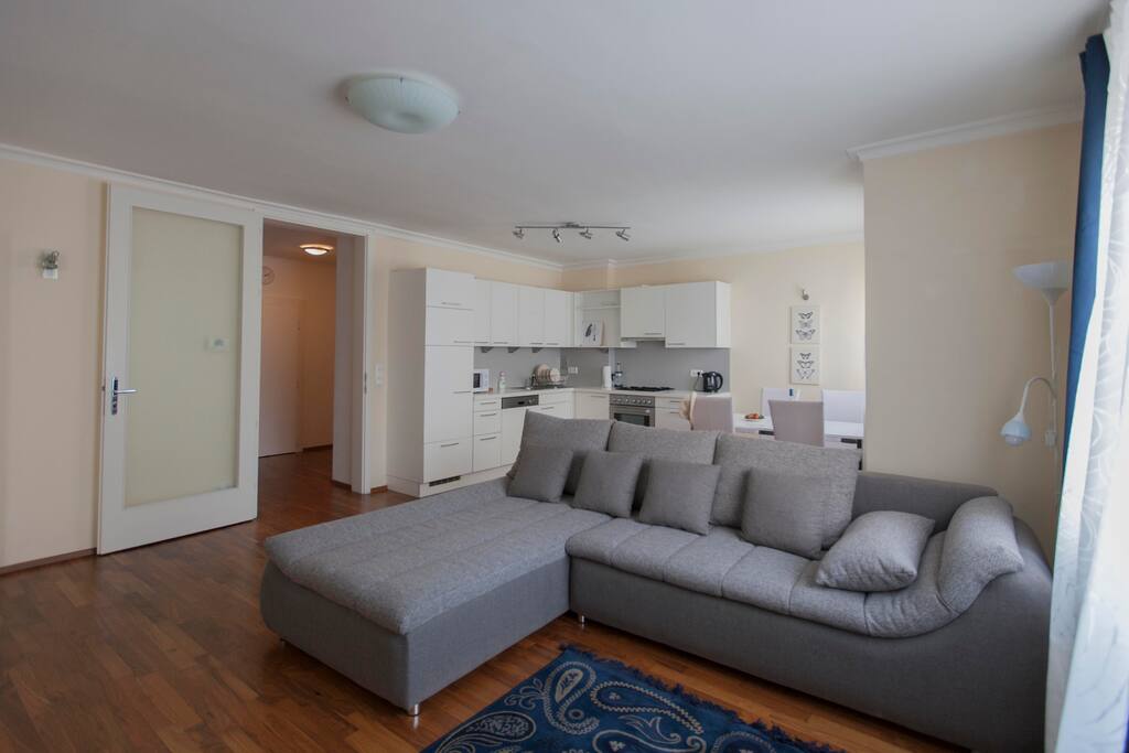 living room with kitchen and dining area