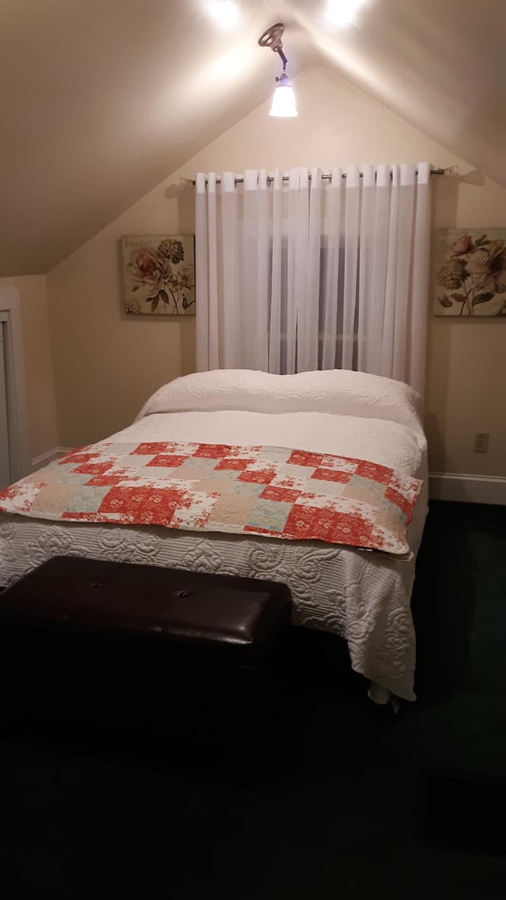 Upstairs full bed. Has small bath attached.