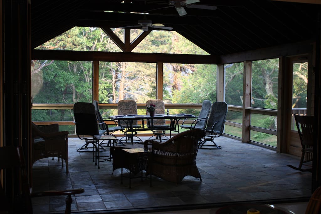 Living room opens onto this huge screened porch