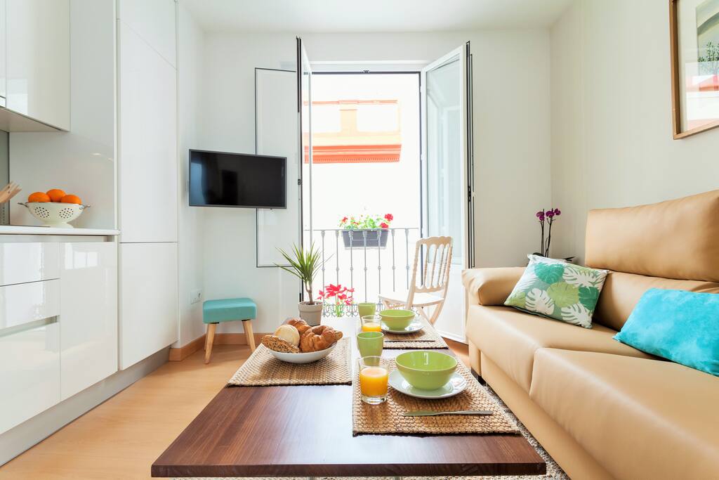 Living room with balcony and smart tv