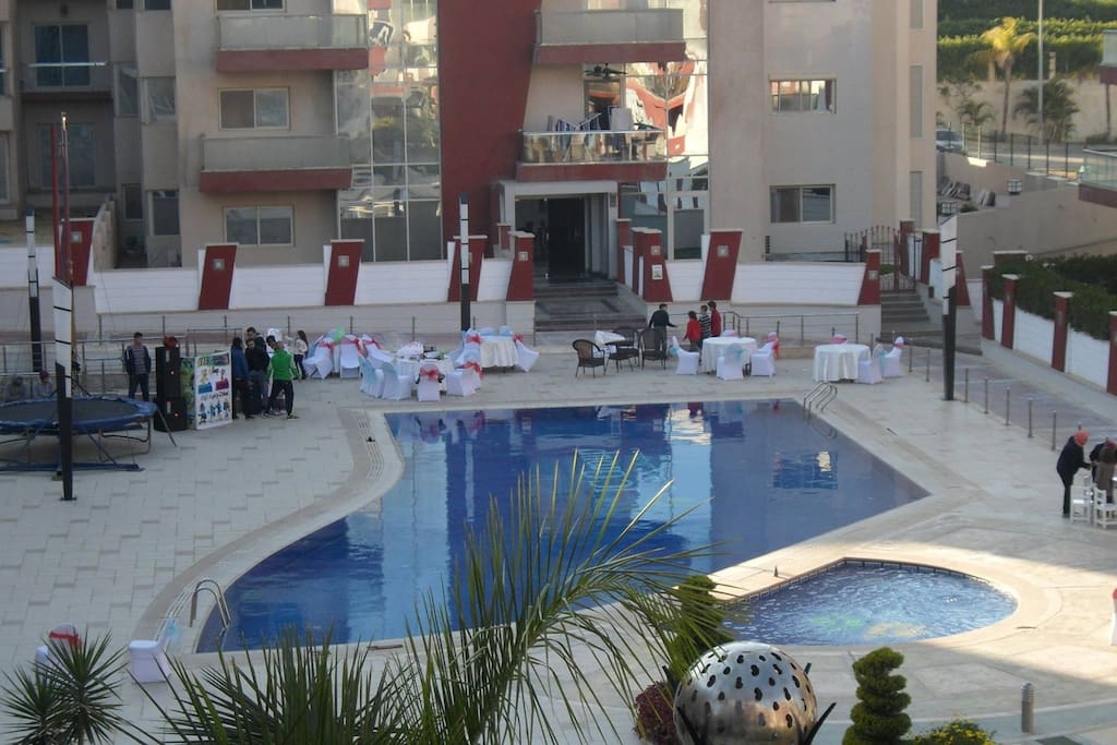 View from balcony with swimming pool and gardens