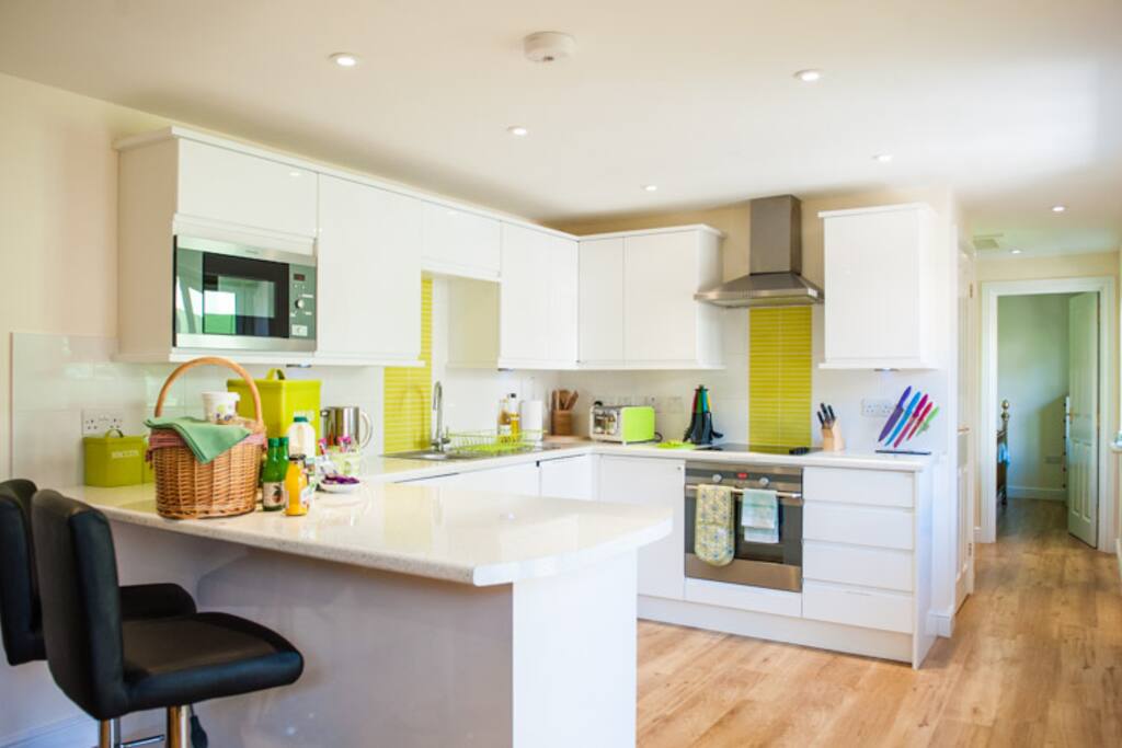Kitchen diner with every appliance, Dolce Gusto with some pods provided, microwave, hob, cooker, washer/drier, many useful extras: foil, kitchen roll, condiments, every utensil. *Perishable items seen on table for photographic purposes only & not supplied.