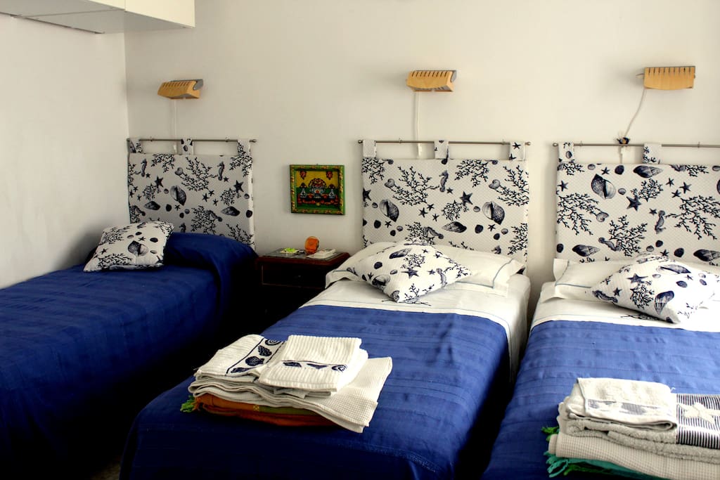 bedroom with three beds