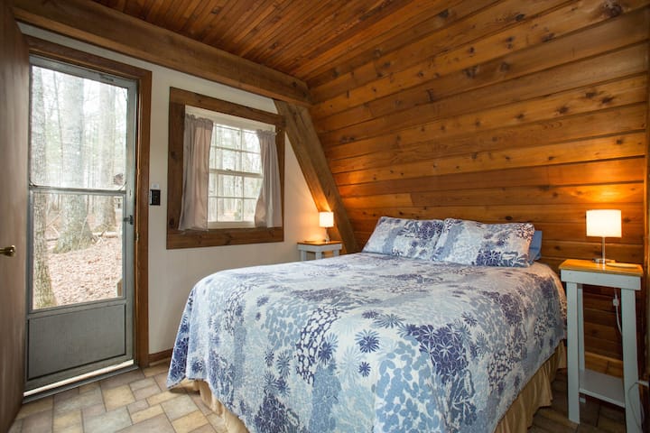 A comfortable queen size bed overlooks beautiful woodlands. Sleep to the sound of a tranquil stream rushing nearby.
