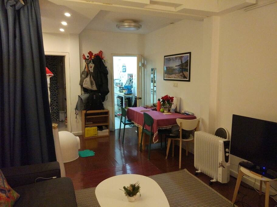 dining area & view of kitchen from living room. Curtain for privacy.