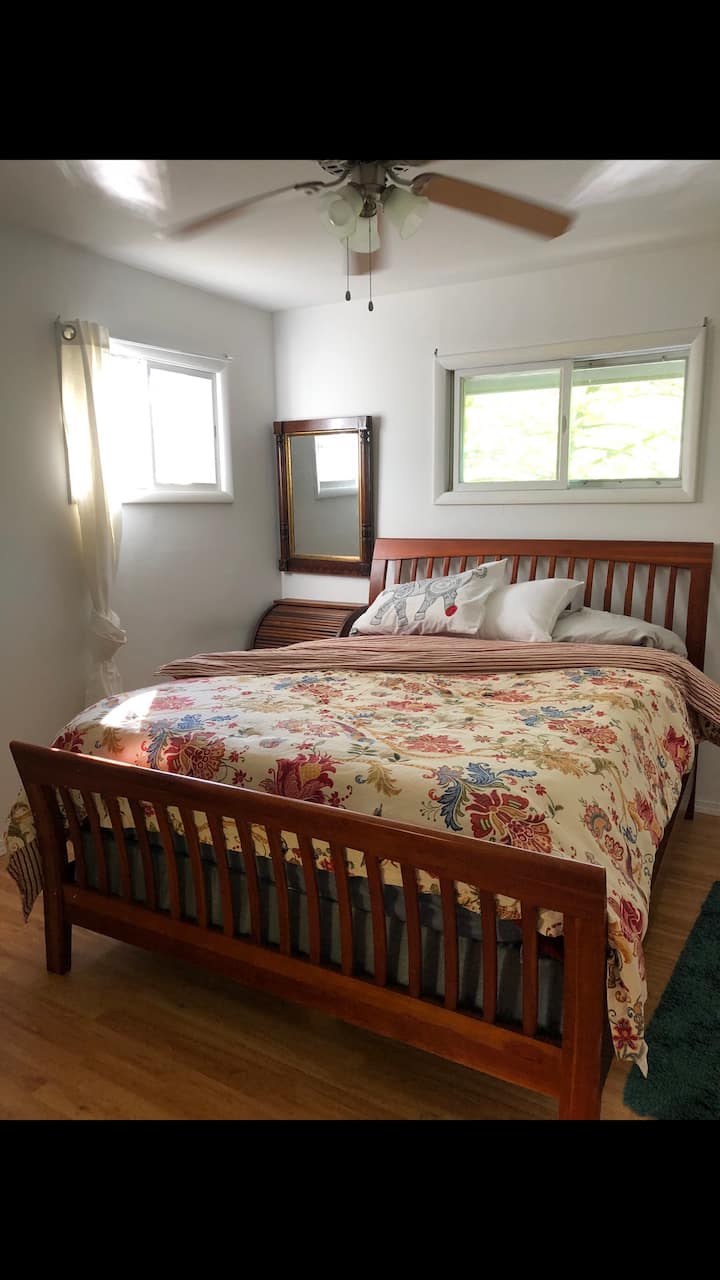 Master bedroom with queen bed.  Bed comforters colors change periodically as we change out and get new ones.   