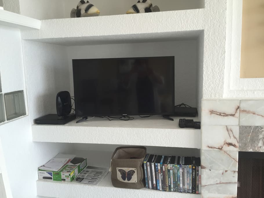 flat screen tv in living room with movies and games