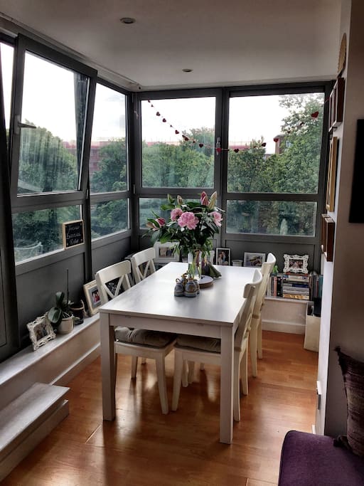 This dining table expands to seat 8 comfortably, and up to 10 people in a squeeze. Chairs + ottoman available to seat up to 8.