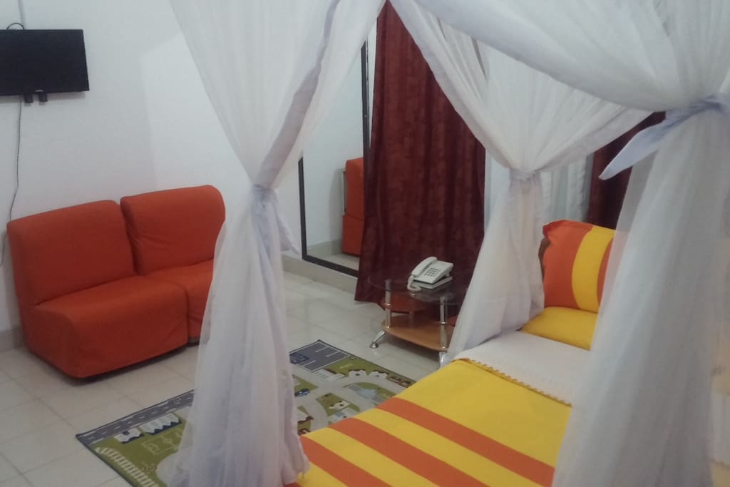 double bedroom with flatscreen Tv and cable channels