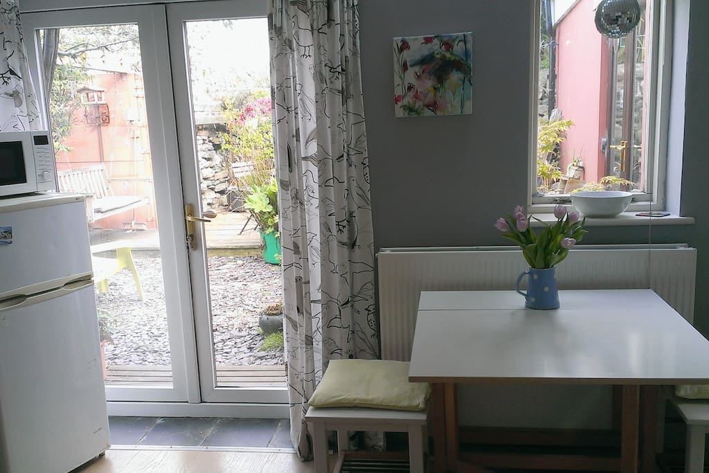 Dining table and doors to garden.