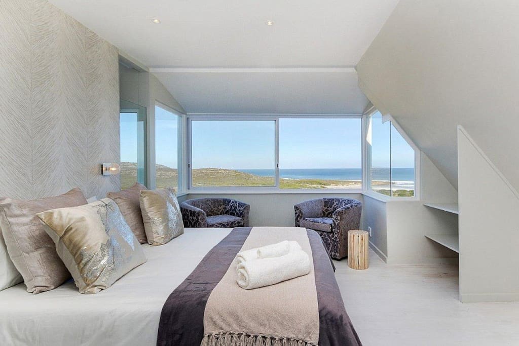 Master bedroom with extraordinary uninterrupted view of beach, sea and horizon - truly a place to relax