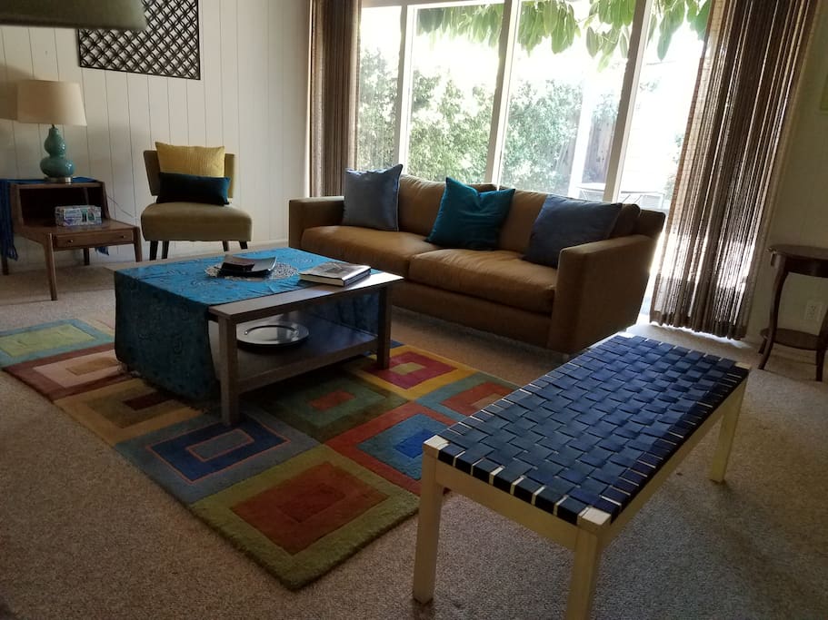 Large window in the living room bring the "outdoors in" as is typical of Eichler homes