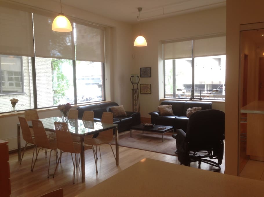 View of the living and dining area with a view of the Festival grounds beyond the balcony
