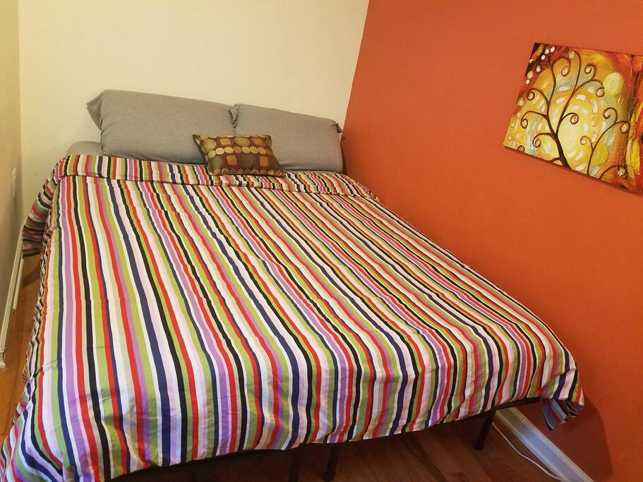 Small, cozy bedroom with queen bed and new memory foam mattress.