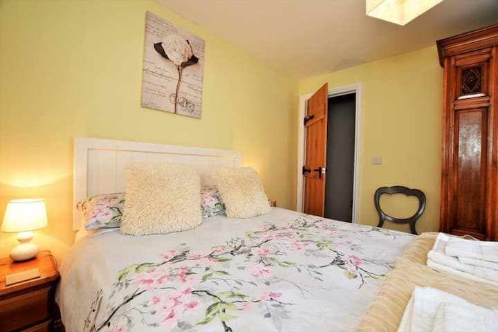 The pretty double bedroom with lots of storage. All bedrooms have t.v’s at Kingfisher Cottage Butterknowle, Bishop Auckland, County Durham.