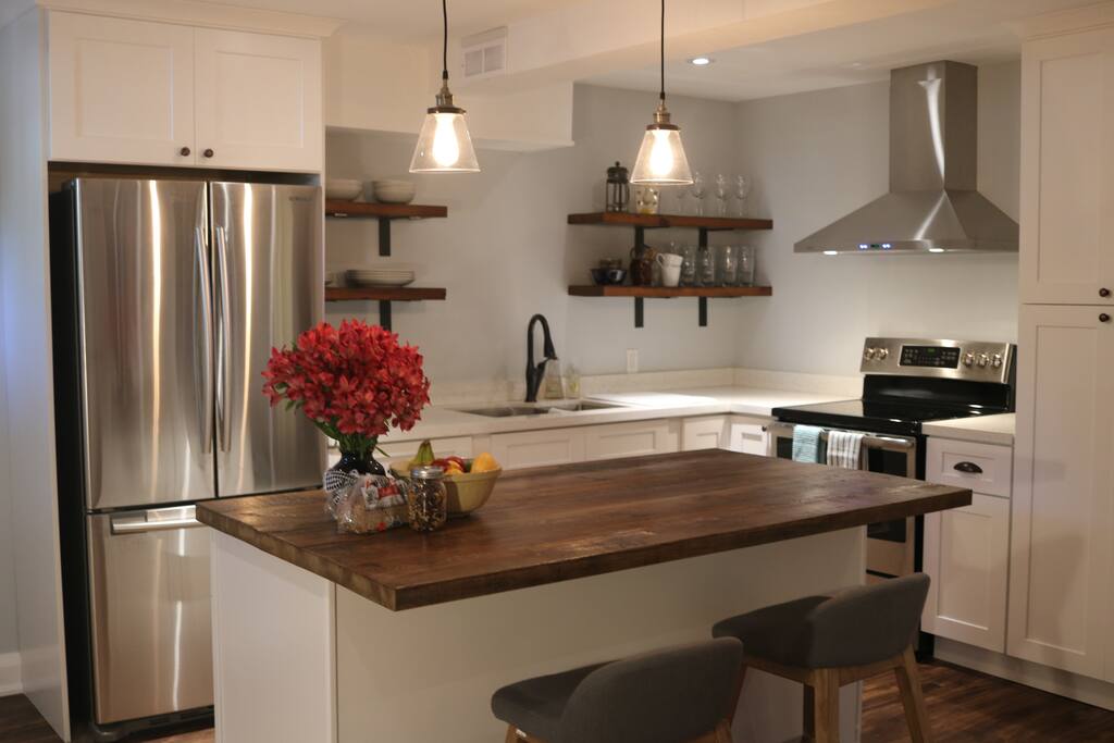 Kitchen with brand new everything and stocked with an assortment of goodies for you such as homemade granola, fresh bread, and seasonal fruit.