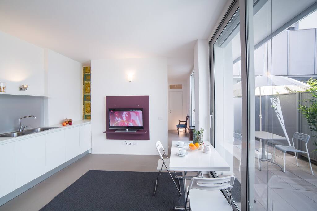 The Living room & The Kitchen - The dining table & the TV