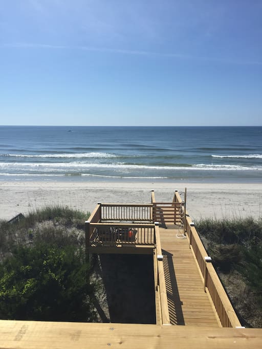 Private decking out to the beach with a shower.