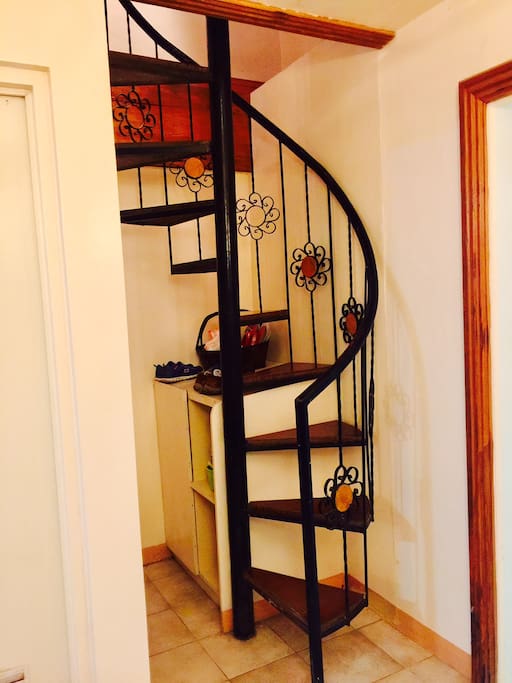 Spiral stairs going to the bedrooms