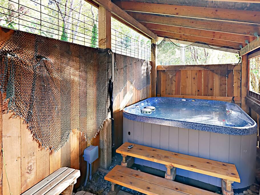Slip into the private hot tub for a relaxing soak.