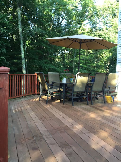 Large deck in a wooded setting