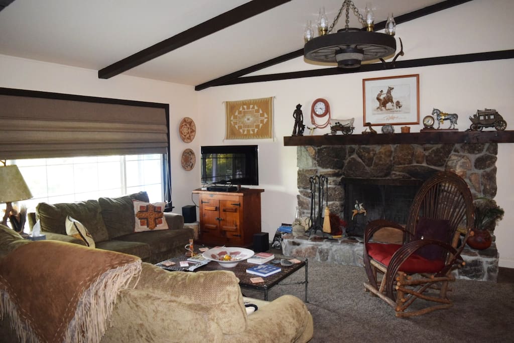 Spacious living room is roomy and comfortable with interesting western decor.